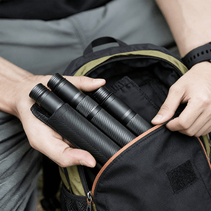 Ergonomic handle with deep-textured anti-slip grip for the Terozi tactical trekking staff, optimized for secure handling in wet weather conditions.